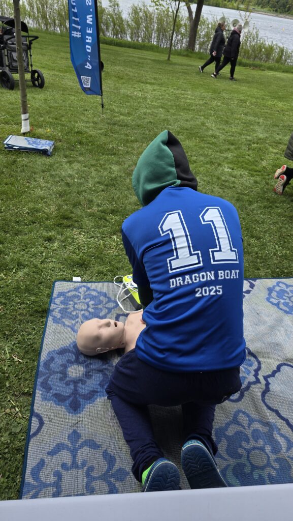 Dragon Boat 2025 participent practicing CPR on dummy